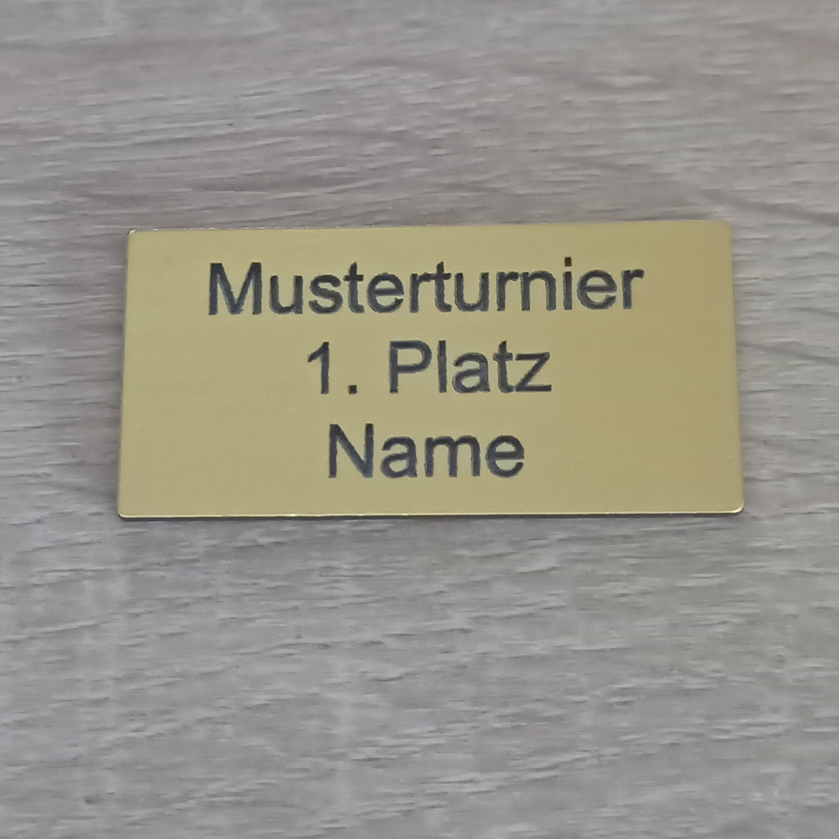Pokalschild Gold 1. Platz